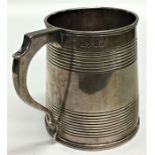 A Georgian silver tapering half pint mug with reed