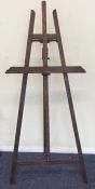 A large easel decorated with panelling. Est. £40 -