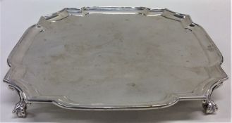 A square silver waiter with cut corners. London. A