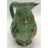 EDWARD BINGHAM: A good pottery water jug decorated with frogs and swans in g