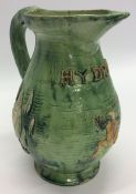 EDWARD BINGHAM: A good pottery water jug decorated with frogs and swans in g