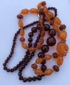 A graduated string of amber beads etc. Est. £40 -