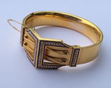 A high carat gold bangle attractively decorated wi