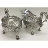 A large pair of George IV silver sauce boats flamb
