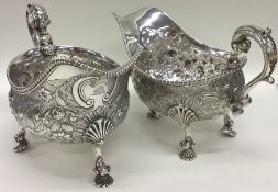 A large pair of George IV silver sauce boats flamb