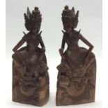 A pair of unusual carved hardwood bookends in the