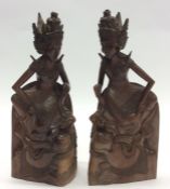 A pair of unusual carved hardwood bookends in the