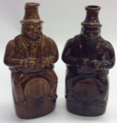 A pair of stoneware Toby jugs, the hats mounted as
