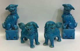 Two pairs of Dogs of Foo in turquoise colour. Est.