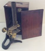 A mahogany cased microscope by W Heath of Plymouth. Est. £30 - £40.