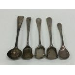 A bag containing silver cruet spoons. Various date