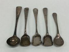 A bag containing silver cruet spoons. Various date