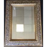 A massive bevel edged mirror in gilt frame. Approx