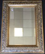 A massive bevel edged mirror in gilt frame. Approx