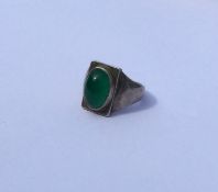 GEORG JENSEN: A silver ring inset with cabochon st