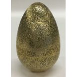 STUART DEVLIN: A silver and silver gilt egg of typ