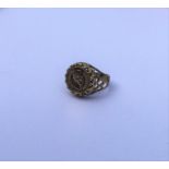 A 9 carat ring mounted with a gold coin. Approx. 4