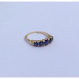 A sapphire and diamond half hoop ring in 18 carat
