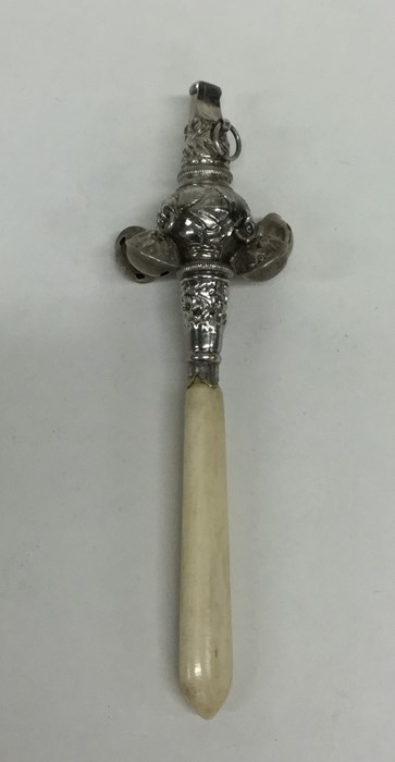 A Georgian style silver embossed rattle / teether.