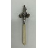 A Georgian style silver embossed rattle / teether.