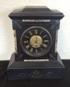 An Edwardian slate mantle clock with silver dial.