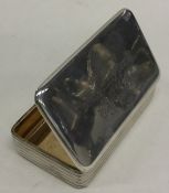 A Georgian reeded silver snuff box with gilt inter