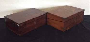 A mahogany writing slope together with one other.