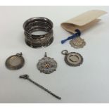 A small silver watch medallion, napkin ring etc. A