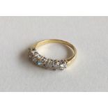 A good 18 carat diamond seven stone half hoop ring
