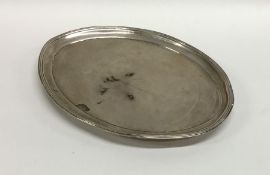 An oval Georgian silver letter tray with central c