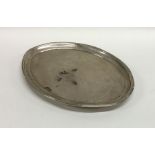 An oval Georgian silver letter tray with central c