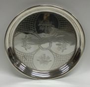 An Edwardian silver waiter decorated with flowers