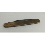 A small 9 carat penknife. Approx. 14 grams. Est. £
