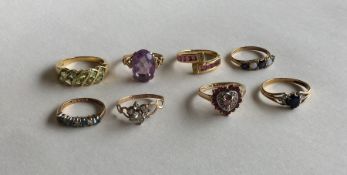 A group of eight 9 carat gem set rings. Approx. 20