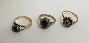 Four diamond mounted 9 carat gem set rings. Approx