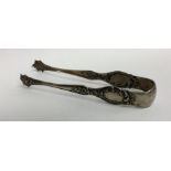 A pair of Continental silver sugar tongs decorated