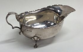 An Edwardian silver sauce boat with canted rim. Sh