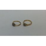 Two 18 carat gold and diamond set rings. Approx. 5