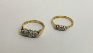 Two 18 carat diamond three stone rings. Approx. 4.