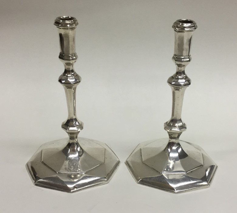 A good pair of cast silver taper candlesticks. Bir