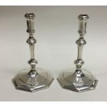 A good pair of cast silver taper candlesticks. Bir