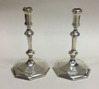 A good pair of cast silver taper candlesticks. Bir