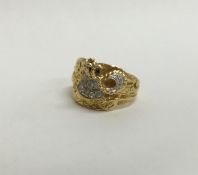 A large heavy gent's 18 carat ring with textured d