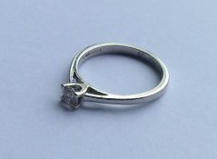 A good platinum and diamond single stone ring in c