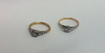 Two diamond single stone rings in 18 carat gold. A
