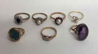 A group of eight 9 carat gem set rings. Approx. 18