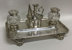 A good lady's silver inkstand on scroll feet with