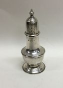 An Edwardian silver baluster shaped pepperette of