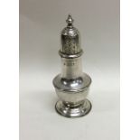 An Edwardian silver baluster shaped pepperette of