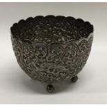 A heavy Indian cast silver sugar bowl decorated wi